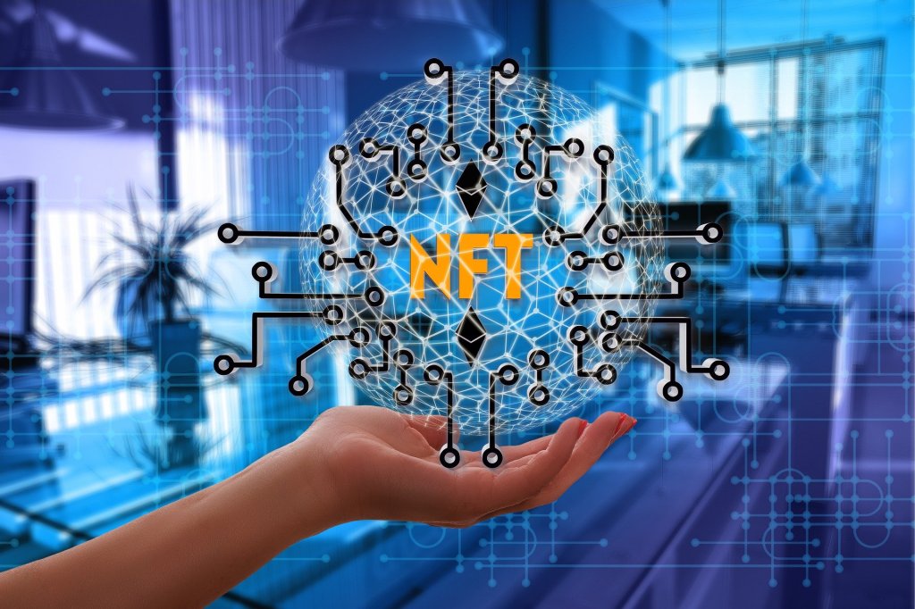 Hand holding globe with NFT label