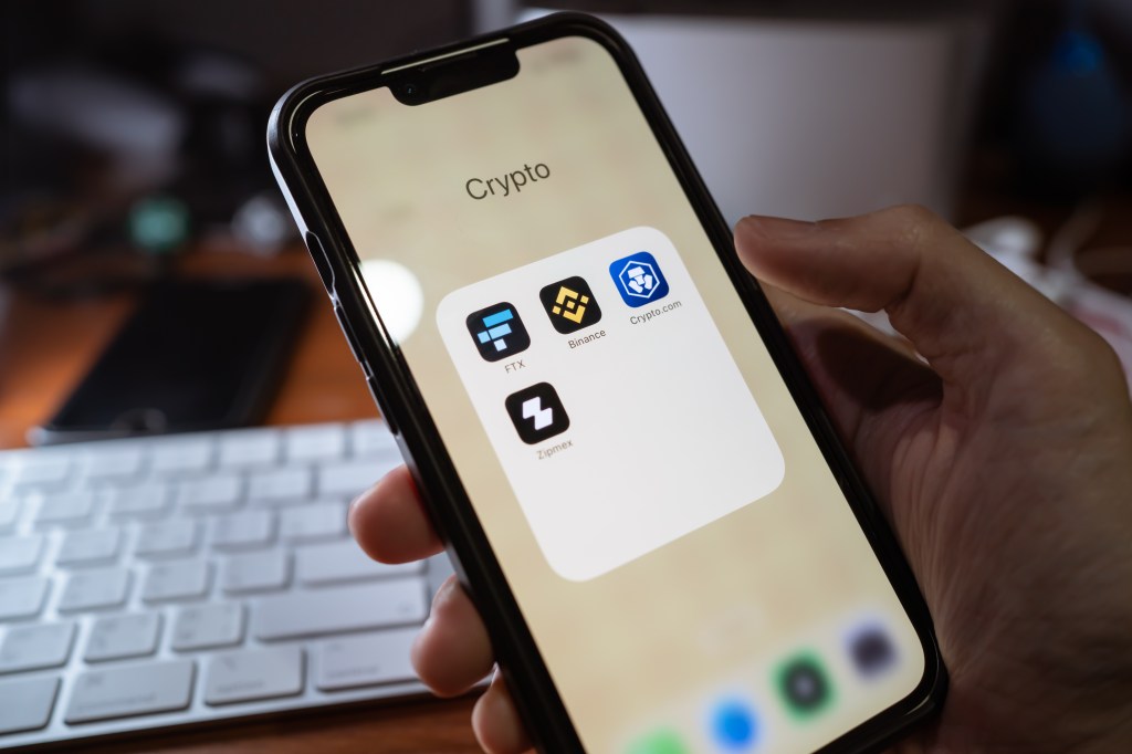 Mobile phone screen showing crypto apps