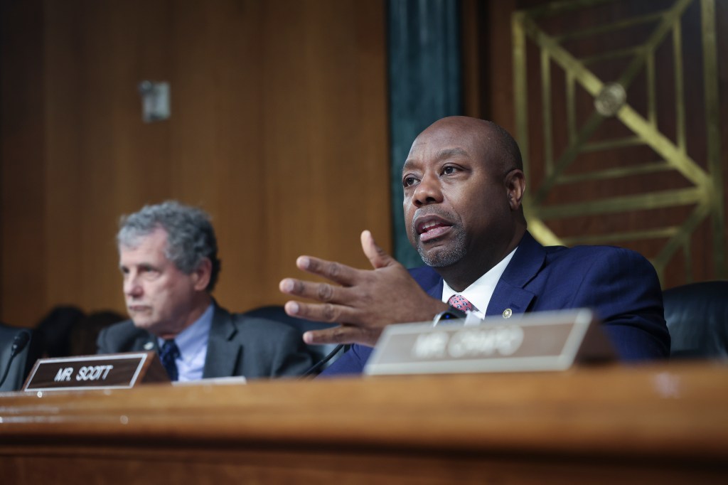 Senators Tim Scott and Sherrod Brown at the Senate banking hearing