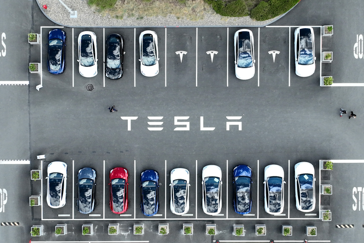A car park filled with Tesla cars.