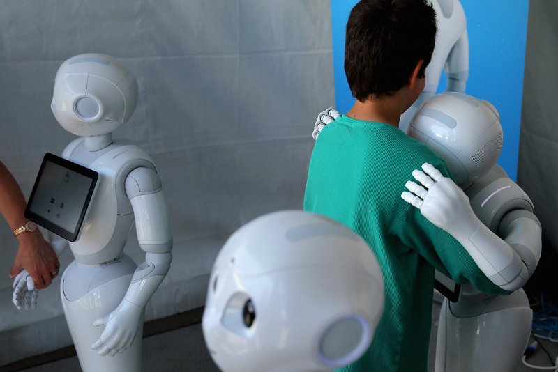 A robot is hugging a child