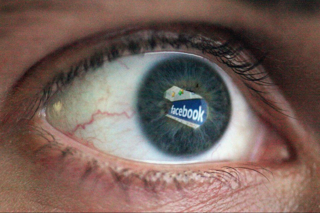 Image of an eye with the word "Facebook" reflected in it.