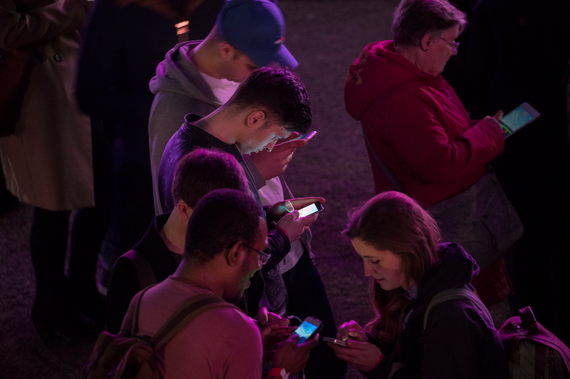 People looking at their mobile phones