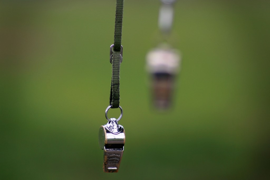 Image of a whistle hanging from a lanyard