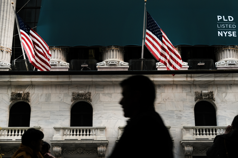 People walk by the New York Stock Exchange