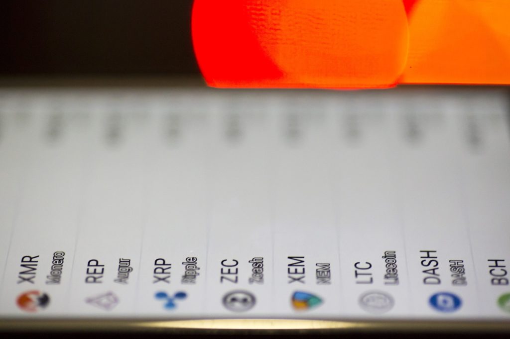 Image of some crypto currencies being shown on a mobile phone.