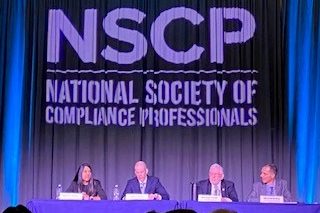 Four SEC Exam Division leaders are seated at a table onstage at the 2023 annual NSCP conference in Dallas, Texas.