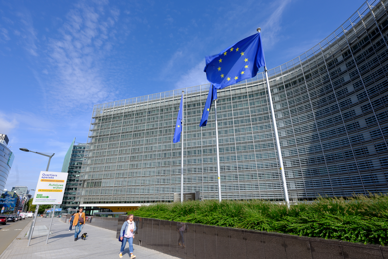 The flags of the European Union flutter in the winds in front of the Berlaymont, the EU Commission headquarter