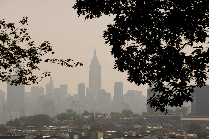 Haze caused by smoke from wildfires in Canada shrouds the skyline of midtown Manhattan and the Empire State Building in New York City
