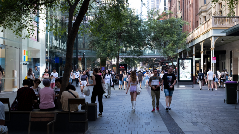 People walk near the Westfield shopping center in Sydney, Australia. 