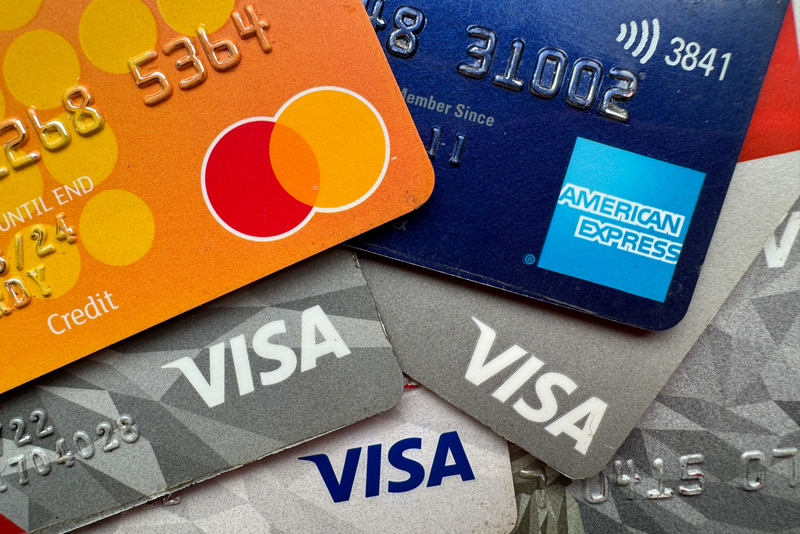 Photo illustration the Visa, Mastercard and American Express logos are seen on credit and debit cards on November 5, 2023