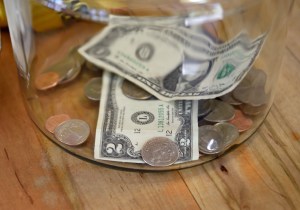 US currency in a glass jar.
