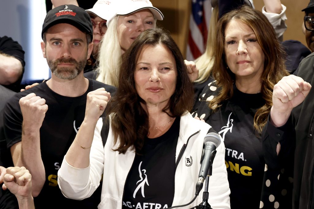Picture of Ben Whitehair, Frances Fisher, SAG President Fran Drescher and National Executive Director Joely Fisher with SAG-AFTRA members during their 2023 strike.