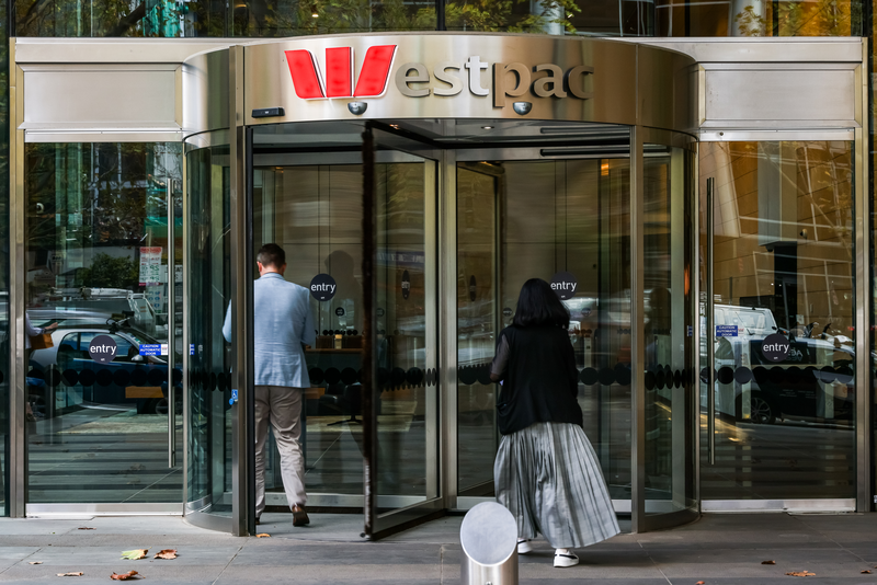 People are seen entering a Westpac bank building.