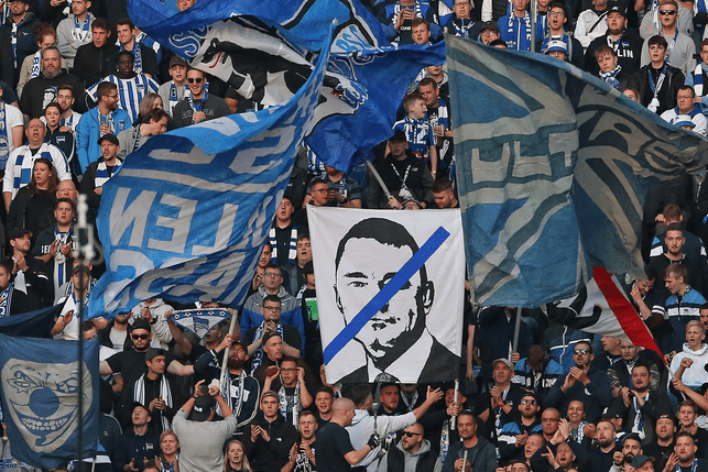 A Poster against Investor Lars Windhorst is held up from supporter of Hertha BSC Berlin during the Bundesliga match between Hertha BSC and Sport-Club Freiburg at Olympiastadion on October 09, 2022 in Berlin, Germany.