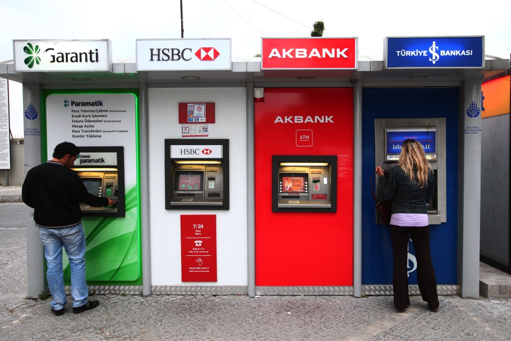 Image of an array of bank cash machines.