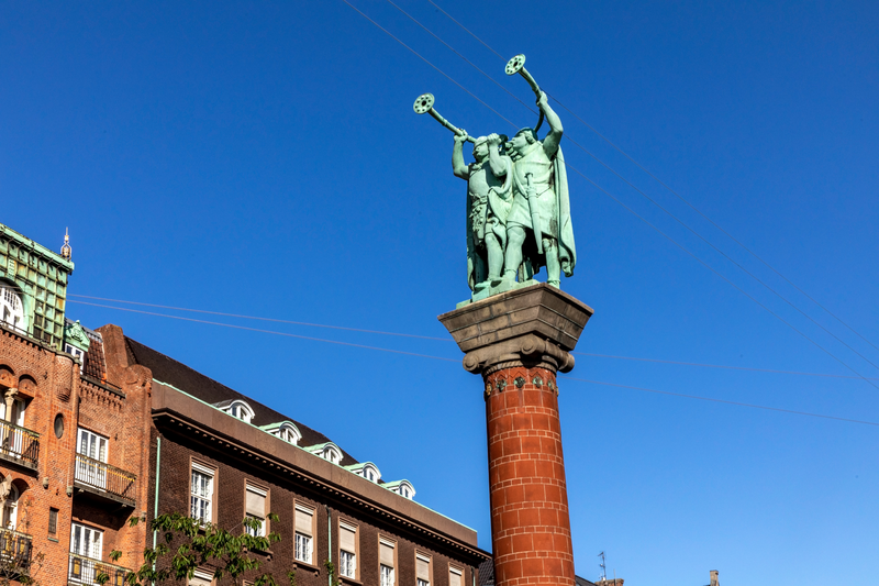 A high statue with two hornists in Copenhagen, Denmark