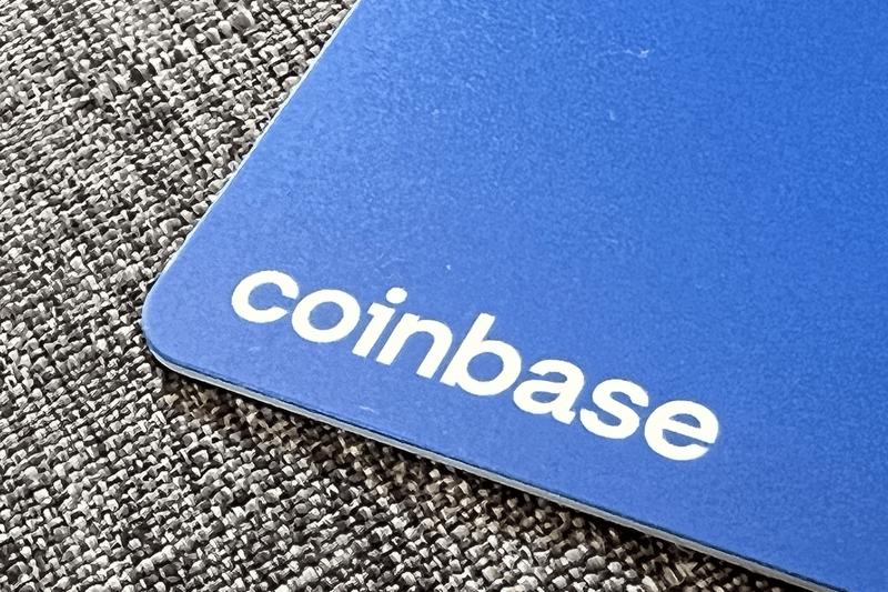 Logo for cryptocurrency exchange Coinbase on debit card edge.