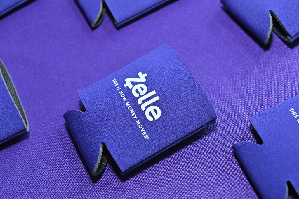 A purple koozie with the word "Zelle" on it.