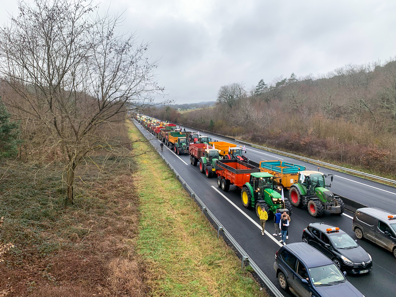 French farmers blocking a road in protest of rising costs and excessive regulation, on January 24, 2024 in Périgueux, Dordogne, FranceFrench farmers blocking a road in protest of rising costs and excessive regulation, on January 24, 2024 in Périgueux, Dordogne, France
