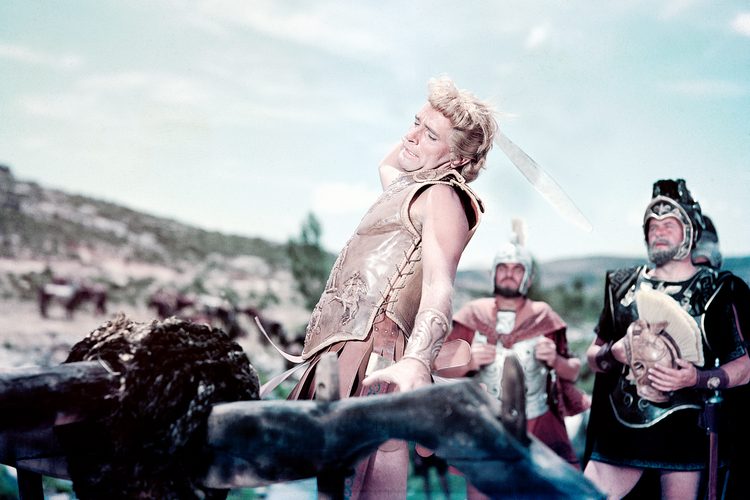 Alexander the Great, played by actor Richard Burton (1925 - 1984) cuts the Gordian Knot in 'Alexander the Great', written, directed and produced by Robert Rossen, 1956.