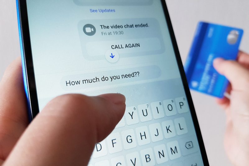 A person texting the words "how much do you need?" - romance fraud.