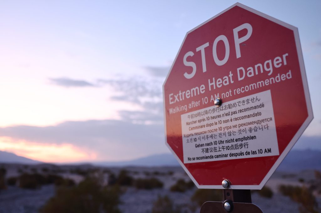 A 'Stop Extreme Heat Danger' sign is posted during a long-duration heat wave which is impacting much of California on July 8, 2024 in Death Valley National Park, California.