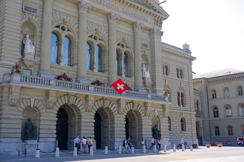 Federal Palace at Bundeshausplatz town square at Swiss city of Bern on a sunny late spring afternoon.