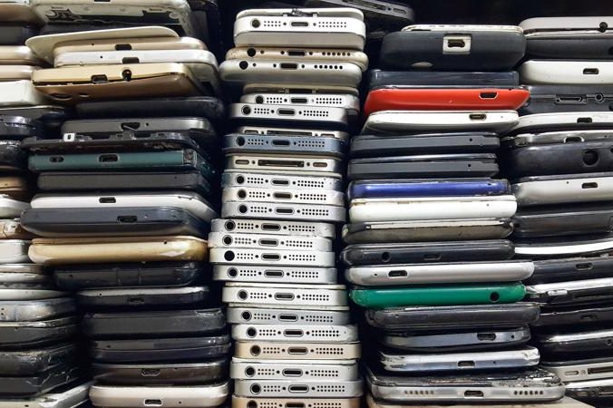 Piles of used smartphones