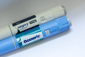 The image shows individual injectable doses of Wevgovy and Ozempic weigh loss drugs.