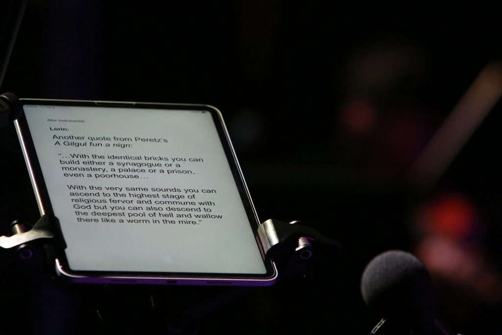 Image of a teleprompter's written notes and microphone.