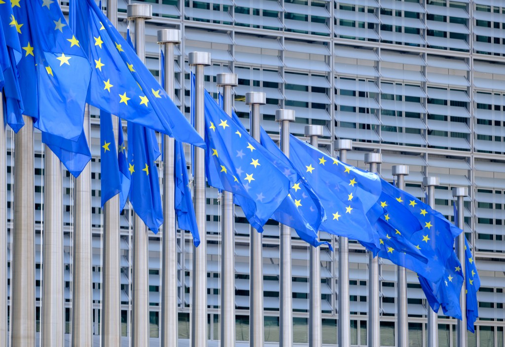 EU flags flutter in the wind in front of the Berlaymont, the EU Commission headquarter