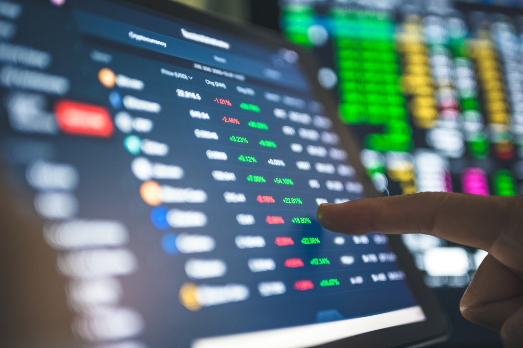 Investor buying cryptocurrency through a mobile app