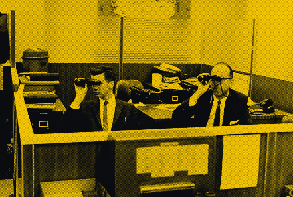 Two men in a New York Stock Exchange office use binoculars, New York City, New York, circa 1962.