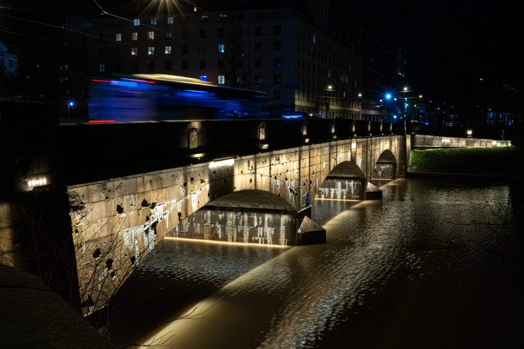 A view of the Long Bridge in Helsinki, Finland at night.