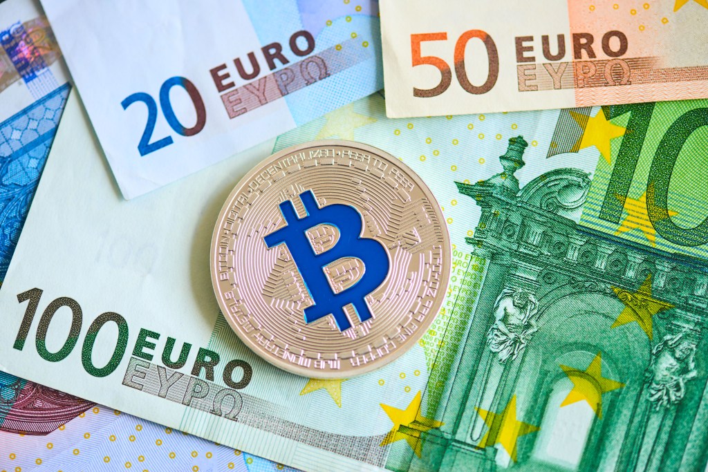 Graphic image of banknotes and bitcoin