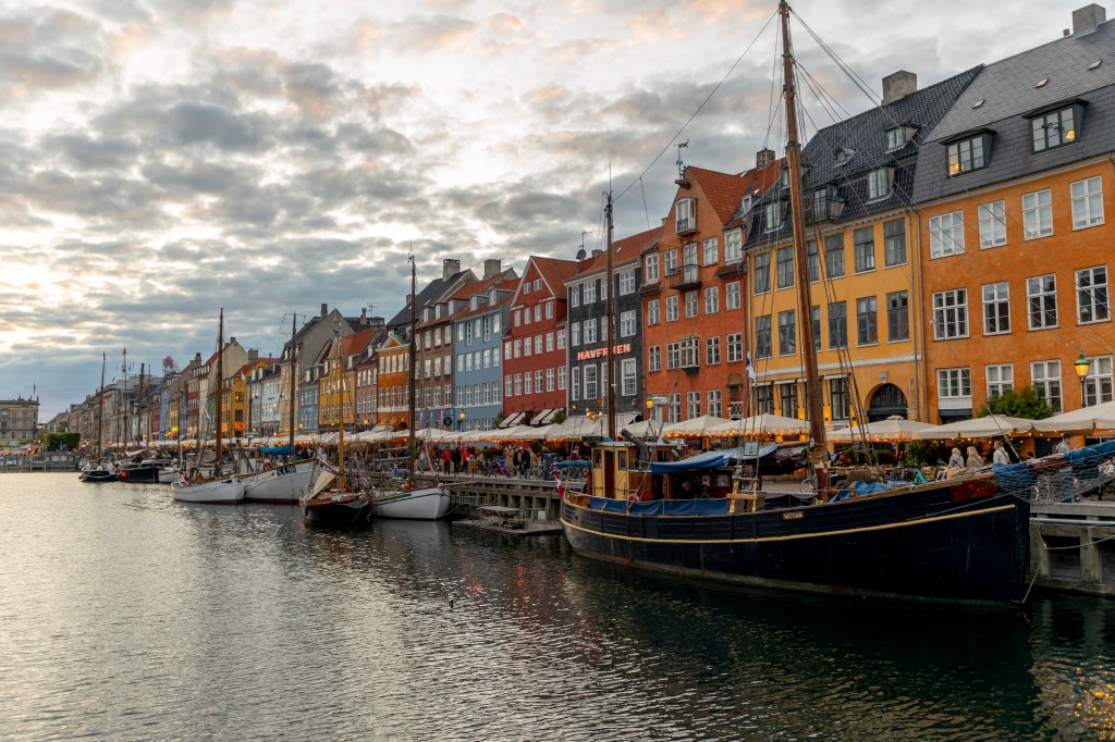 Colorful old houses in Nyhavn waterfront on May 29, 2022 in Copenhagen, Denmark