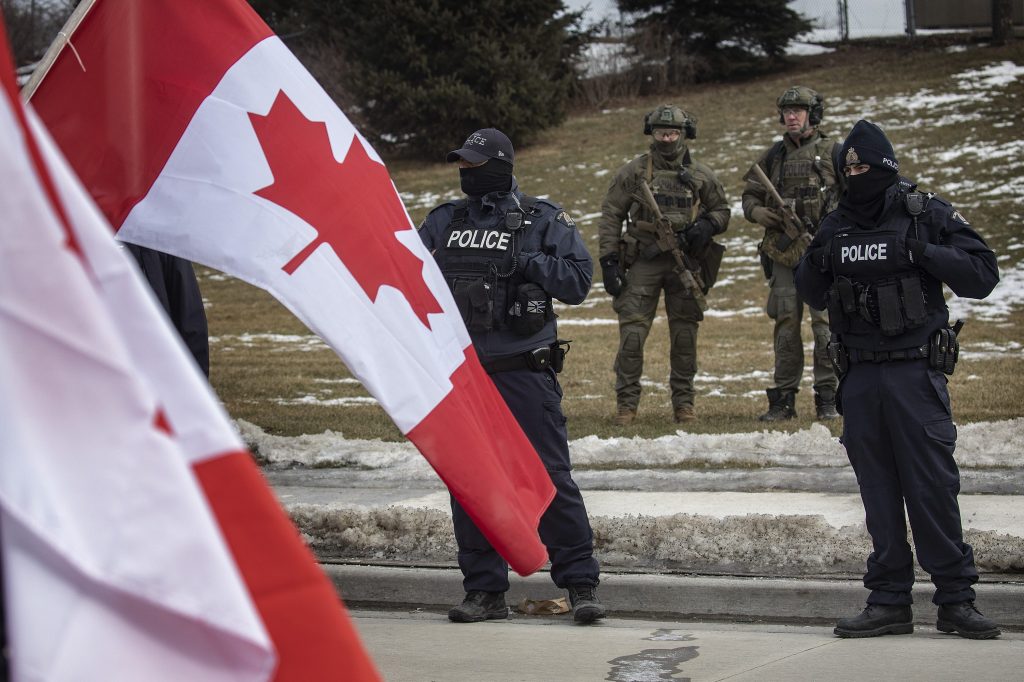 Canadian flag and police