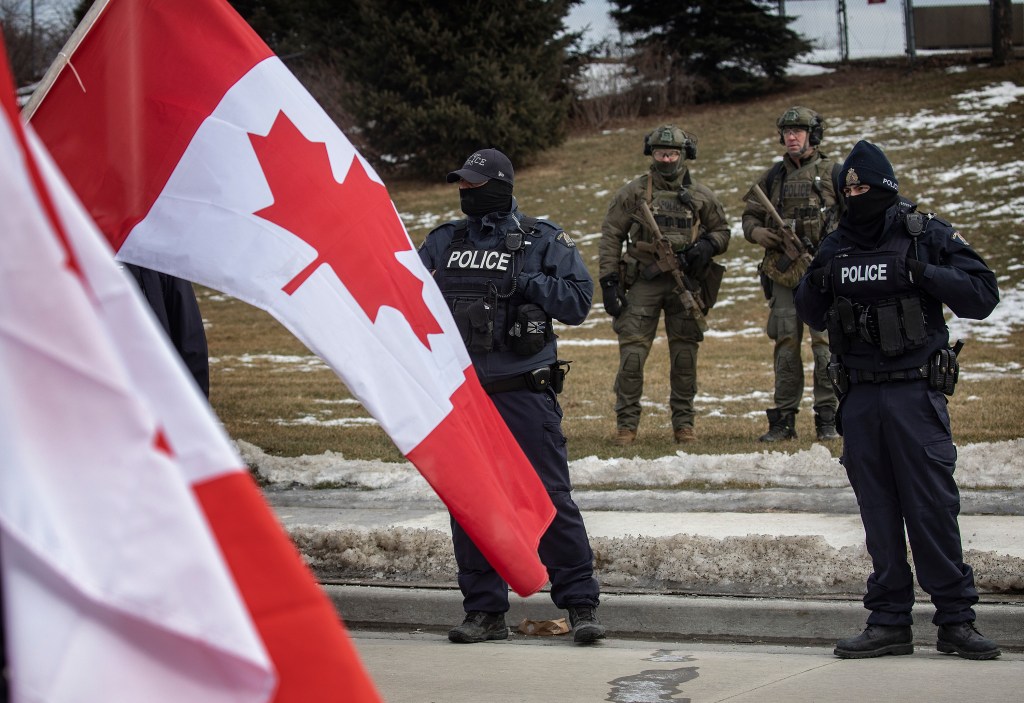 Canadian flag and police