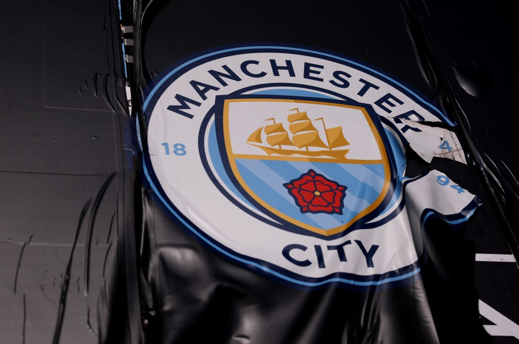 Tattered Manchester City crest