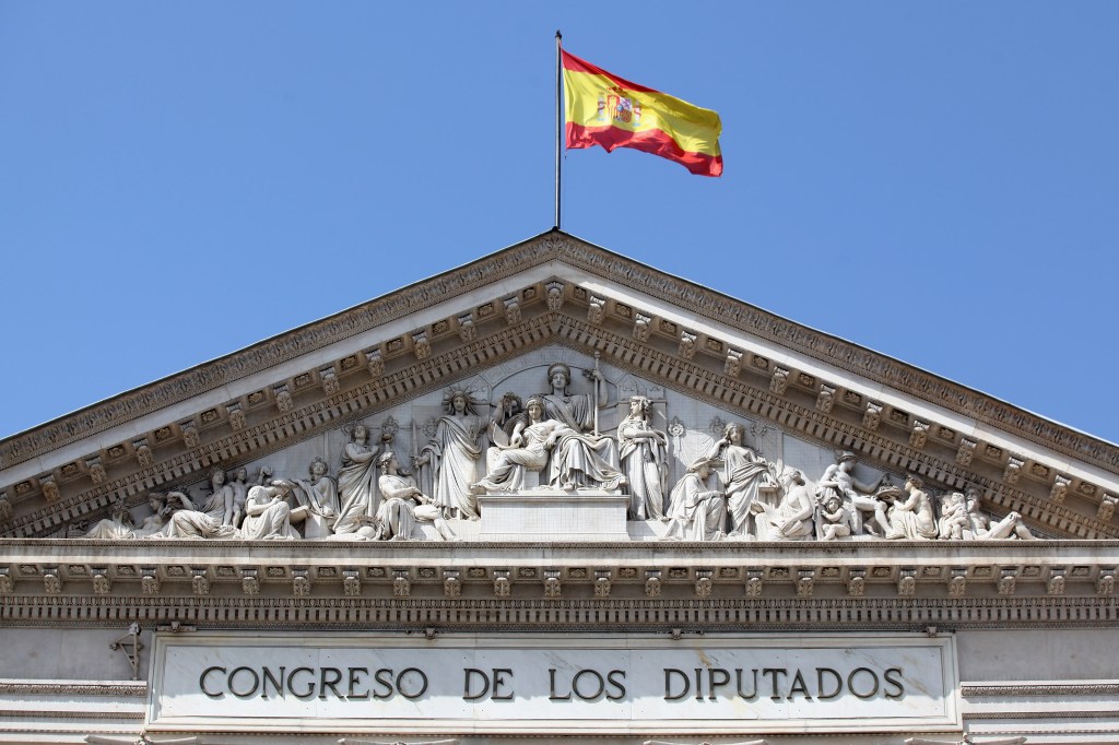 A Spanish flag flies above the Parliament building on July 4, 2012 in Madrid, Spain.